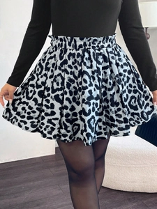 Detailed view of elastic ruffled high waist and black white leopard print on A-line skirt