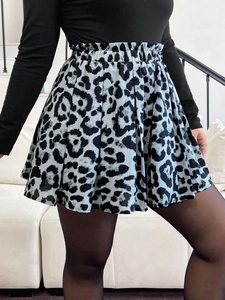 Close-up of high-waist light blue leopard print pleated mini skirt with elastic waist