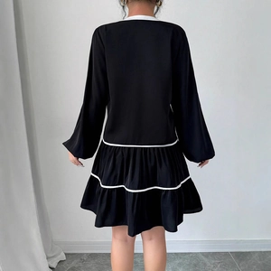 French style black long sleeve mini dress with white tiered ruffles and contrast trim
