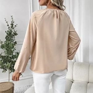 Elegant champagne satin long sleeve blouse with pearl embellishments and open back design