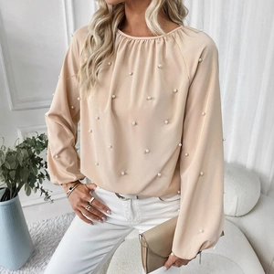 Elegant beige long sleeve blouse with puff sleeves and pearl bead embellishments