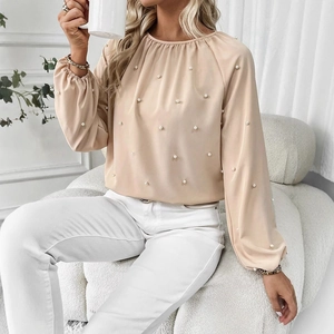 Elegant apricot long sleeve blouse for women with delicate pearl bead accents and puff sleeves