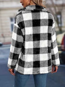 Macro detail of the plush black and white checkered faux fur fabric on this loose jacket
