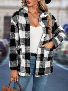 Detailed view of the soft flannel texture and black and white plaid pattern on the women's jacket