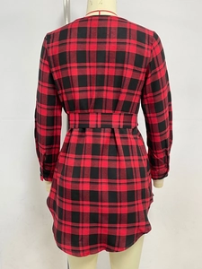 Detail view of red and black plaid long sleeve dress with waist belt from the back