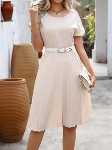 Detailed view of apricot pleated A-line dress with white thin belt and round neck