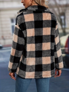 Rear view of oversized plaid wool cardigan featuring black and beige checkerboard pattern