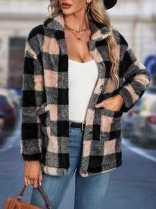 Close-up of pink and black plaid faux fur jacket featuring soft texture and front pockets