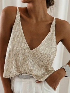 Close-up of champagne sequin camisole top featuring deep V-neck and delicate straps