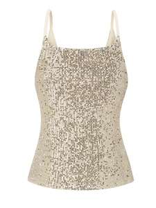 Detailed close-up of champagne gold sequined fabric and thin straps on camisole top