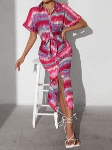 Detail of summer striped shirt dress with tie waist and geometric ethnic pattern