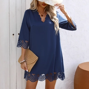 Elegant navy blue summer dress with laser-cut floral details and wavy scallop edges