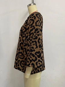 Detailed side view of women's leopard print blouse showing soft fabric and loose fit
