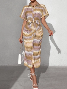 Detailed view of geometric print summer shirt dress with lapel collar and waist tie belt
