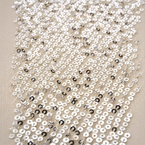 Women's sexy V-neck sequin camisole top featuring shimmering silver sequins on mesh