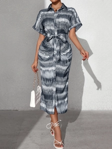 Close-up of short-sleeve tie-waist shirt dress with grey tie-dye print and buttons