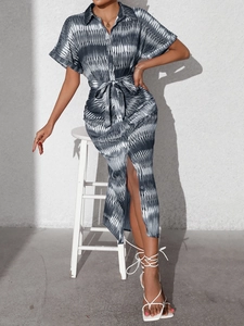 Detailed view of striped shirt dress with waist tie and button-down front details