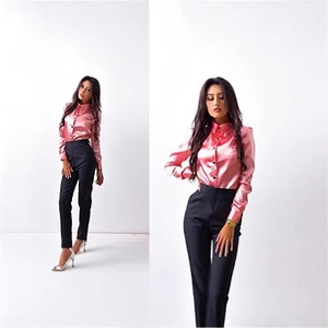 Women's elegant pink satin long sleeve shirt and black high-waisted slim trousers set