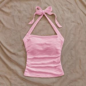 Pink halter top with textured wave ripple fabric and neck tie closure for women