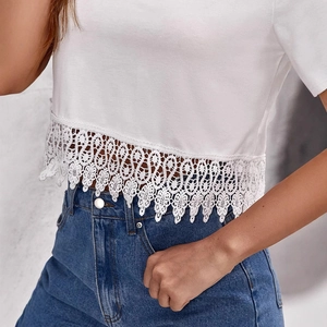 Women's white V-neck crop top with floral lace trim and short sleeves in summer style