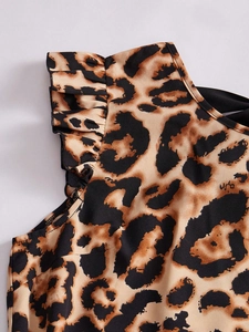 Detail of leopard print dress showing ruffle sleeves and lightweight woven texture