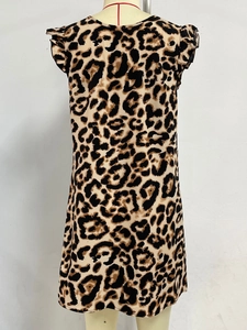 Detail shot of leopard print fabric with butterfly sleeves on an A-line dress