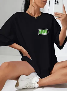Detail of printed 100 percent battery icon on black oversized cotton crewneck t-shirt
