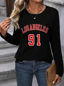 Detail of Los Angeles 91 print on women's black long sleeve top with athletic style