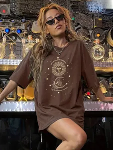 Detail of sun and moon astrology print on a loose dark brown cotton T-shirt