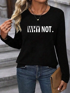 Close-up of black long sleeve sweatshirt with white WHY NOT letters in casual outdoor setting