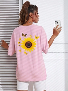 Pink crew neck t-shirt with large sunflower and butterflies print on the back