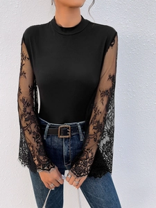 Women's black slim fit bodysuit with dramatic floral lace long flare sleeves and mock neck