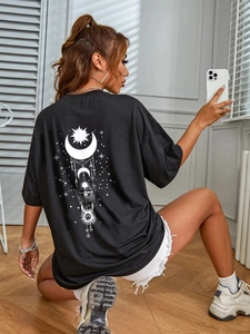 Women's oversize black T-shirt featuring white celestial sun and moon prints on the back