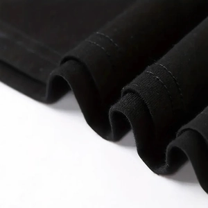 Close-up of black floral long sleeve T-shirt showing detailed double-needle cuff stitching