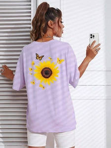 Detail of light purple t-shirt featuring sunflower and butterfly print on back side