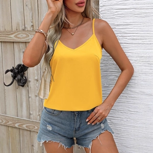 Women's yellow V-neck camisole top with thin straps and casual denim shorts