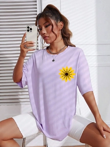 Women's oversized purple short sleeve t-shirt with yellow sunflower print and crew neck