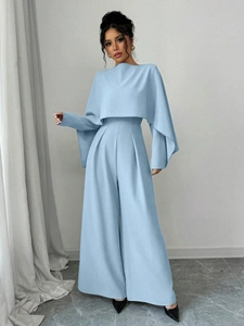 Elegant light blue long sleeve jumpsuit with cape design and wide leg trousers for women