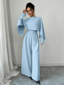 Elegant light blue cape-style wide-leg jumpsuit with high waist and round neck