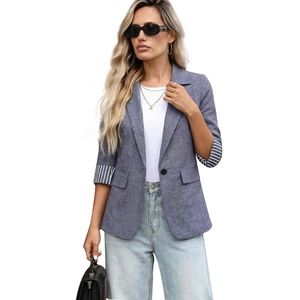Women's blue casual blazer with striped cuffs and single button over a white t-shirt