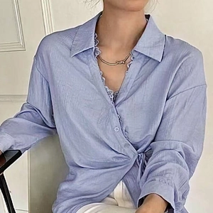Elegant light blue textured long sleeve shirt with lace trim and waist tie detail