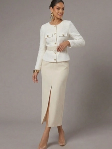 Close-up of white tweed jacket with gold buttons and cream high-waisted skirt detail