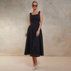 Elegant black sleeveless midi dress with embossed floral embroidery and A-line silhouette