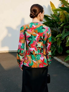 Rear view of tropical floral long sleeve shirt with vibrant emerald and red leaf prints