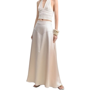 Elegant champagne satin long skirt paired with a white crochet knit halter top for women