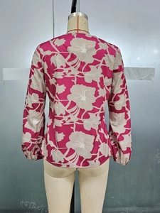 Detail of the back view of a floral V-neck long sleeve blouse with elastic cuffs