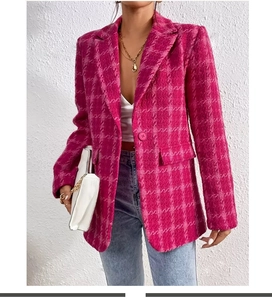 Detailed texture of vibrant pink plaid tweed blazer with single button and lapel design