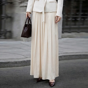 Elegant cream pleated maxi skirt for women with a minimalist satin finish and high drape