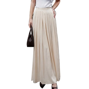 Elegant high-waisted beige pleated maxi skirt in a classic satin-like umbrella silhouette