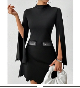 Detail of split sleeves and rhinestone waist embellishments on a black slim dress